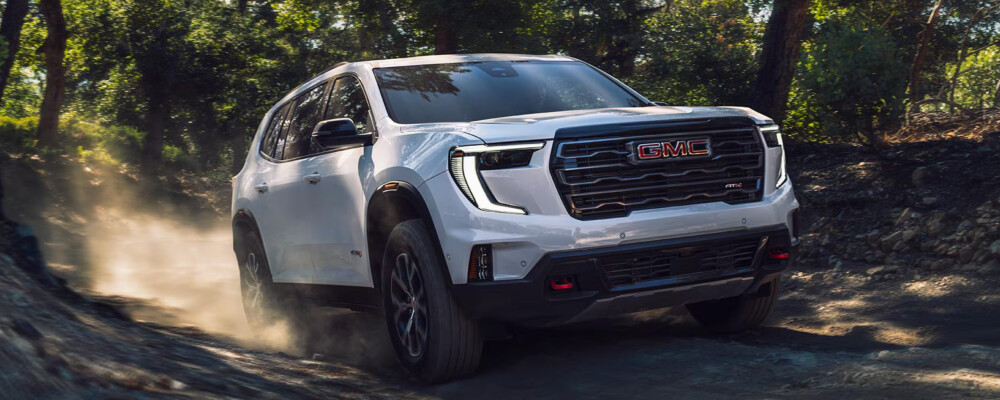 2026 GMC Acadia white exterior off-roading
