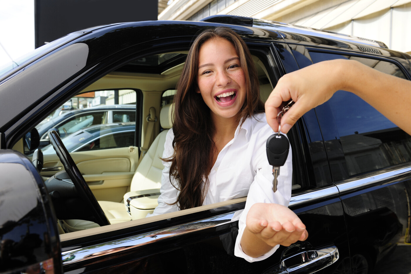 Woman Getting Keys To New Car
