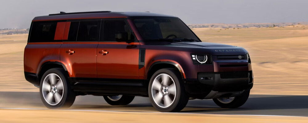 2026 Land Rover Defender driving in sand