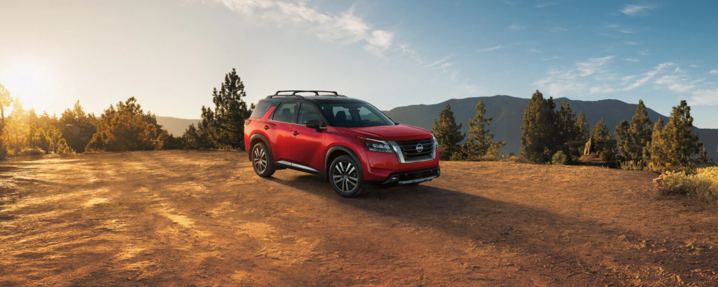 2025 Nissan Pathfinder parked by mountains 2025 Nissan Pathfinder parked by mountains