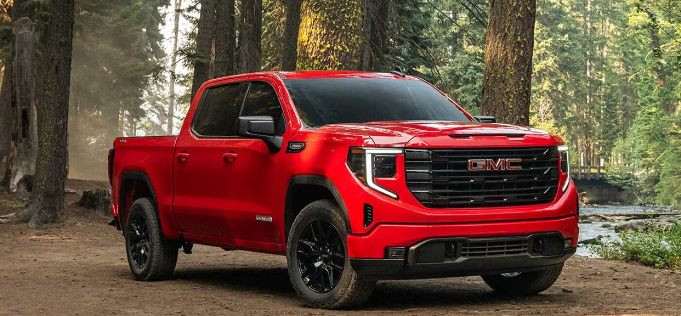 Red 2026 GMC Sierra 1500 in the woods