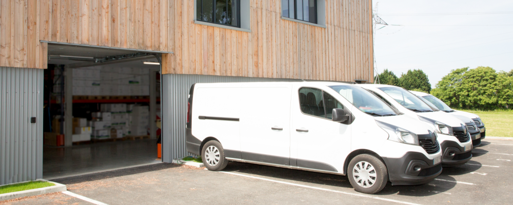 Cargo Vans Commercial Warehouse Cargo Vans lined up at warehouse delivery trucks