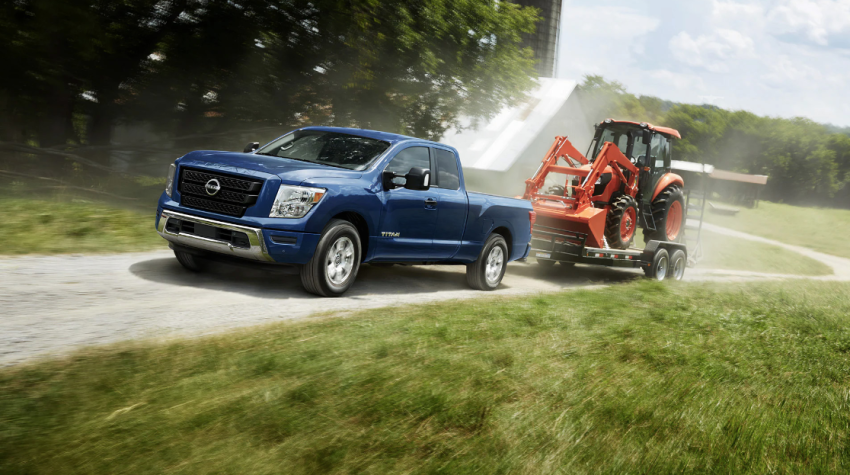 2023 Nissan Titan towing a tractor