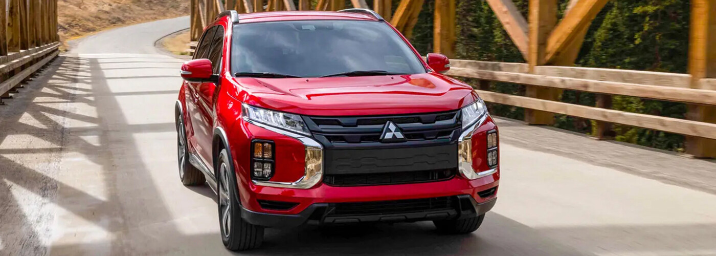2025 Mitsubishi Outlander Sport driving across bridge