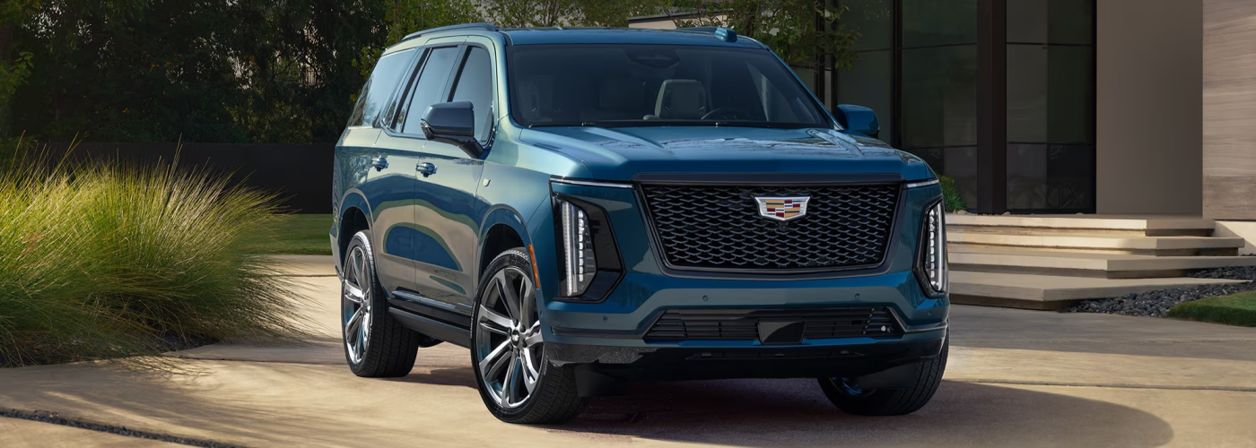 Blue 2026 Cadillac ESCALADE parked in driveway 