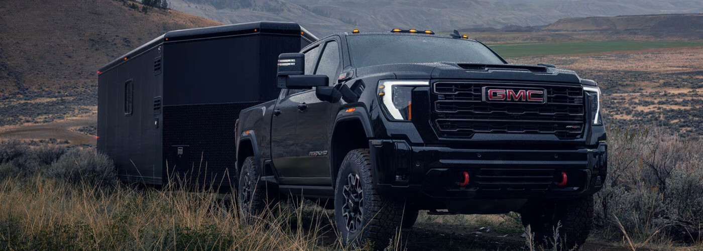 2026 GMC Sierra 2500 HD towing in grass