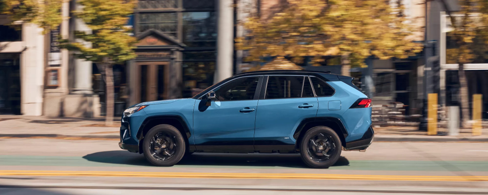 2025 Toyota RAV4 Hybrid shown in Cavalry Blue with Midnight Black Metallic Roof