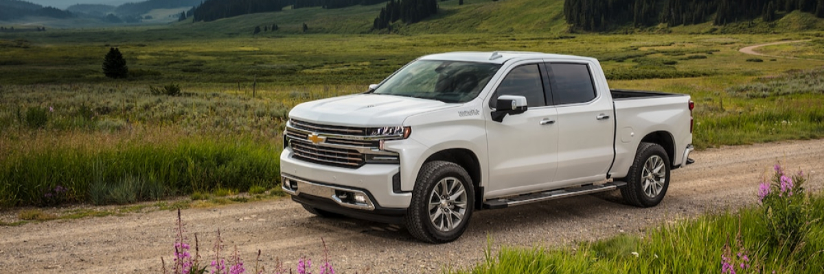 2021 Chevy Silverado 1500 White 2021 Chevy Silverado 1500 driving through a valley