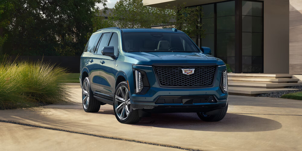 Blue 2026 Cadillac ESCALADE parked in driveway 