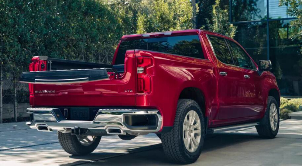 Red 2026 Chevy Silverado 1500 with tailgate down 
