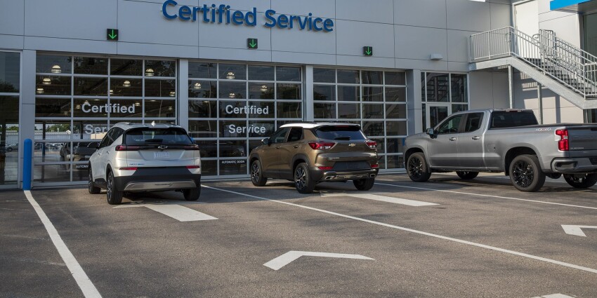 Certified Chevrolet Service Garage with Doors shut and Chevrolet vehicles parked in front