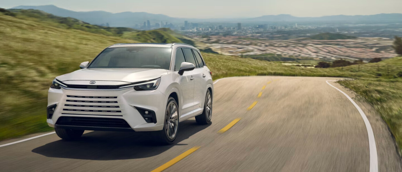 2026 Lexus TX on country road with city in background