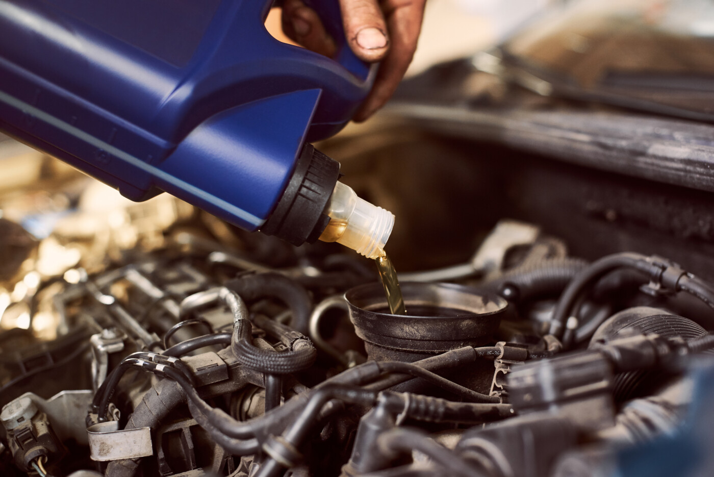 Mechanic performing oil change