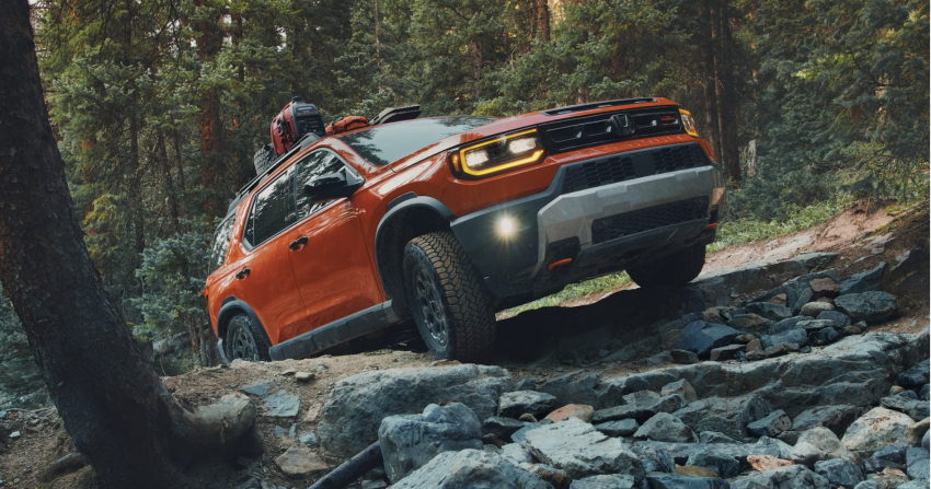 Orange 2026 Honda Passport in Forest