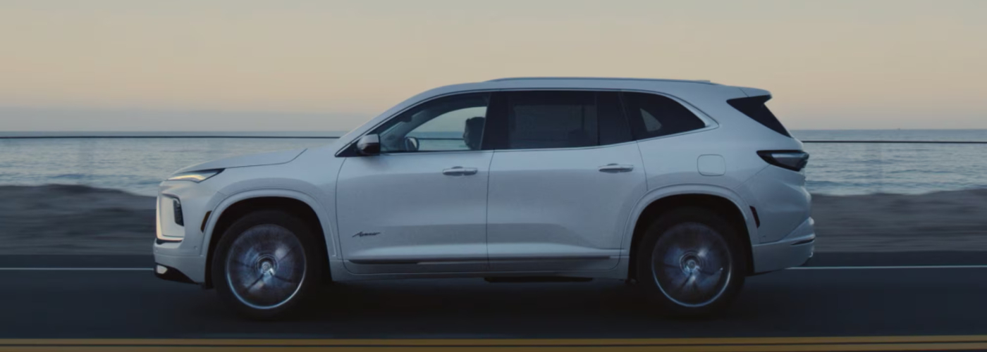 2026 Buick Enclave driving down the road