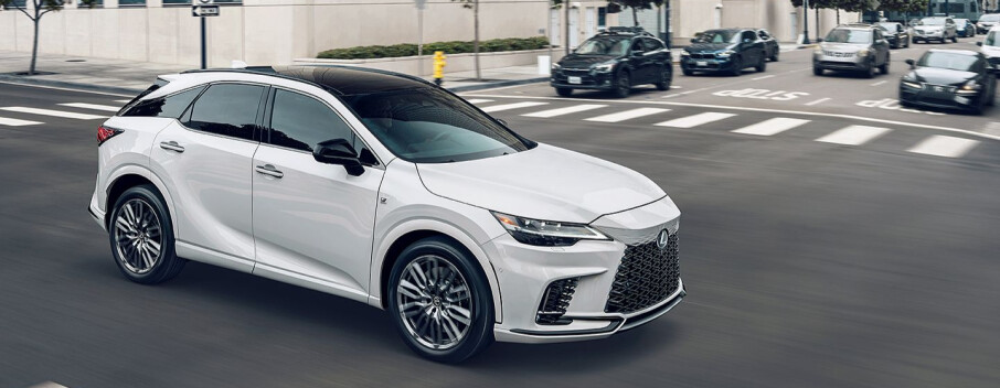 A White Lexus RX driving on a road