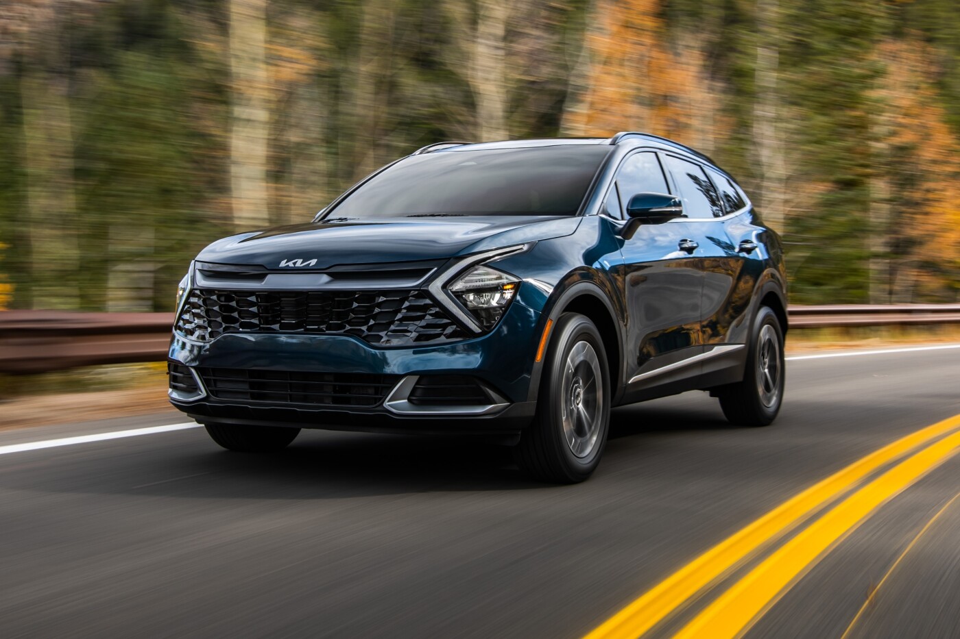Front driver-side view of 2023 Kia Sportage Hybrid on road