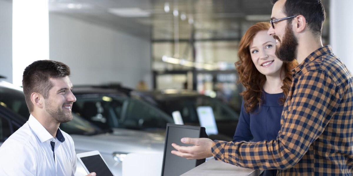 Excited Couple Reviewing Trade in Offer with Salesman Excited Couple Reviewing Trade in Offer with Salesman