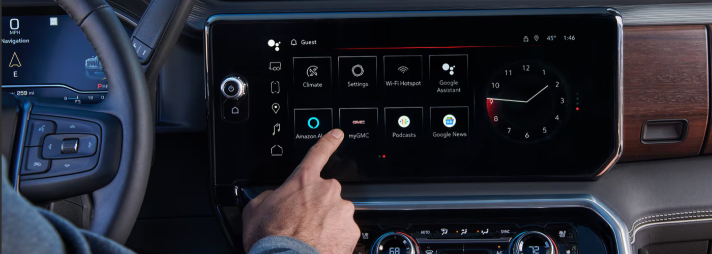 The driver is using the touch screen that sits above the radio.