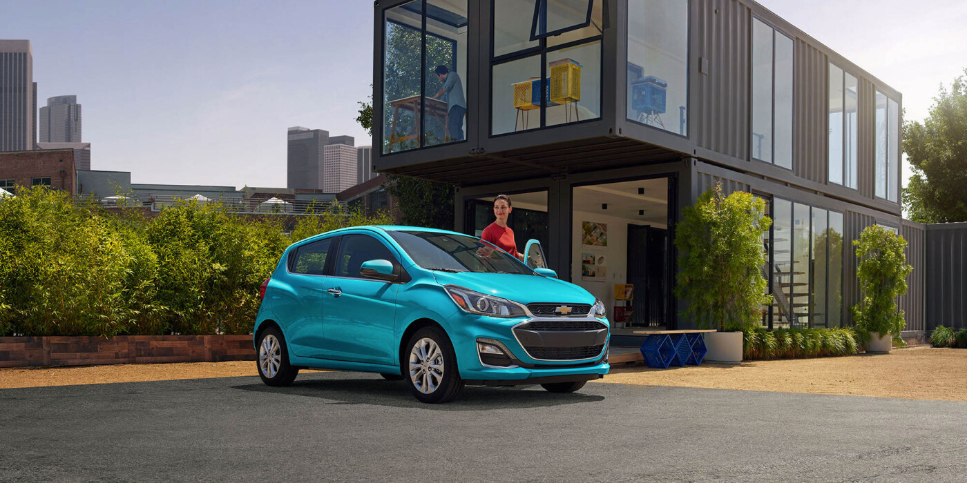 2021 Chevrolet Spark Woman getting into a 2021 Chevy Spark