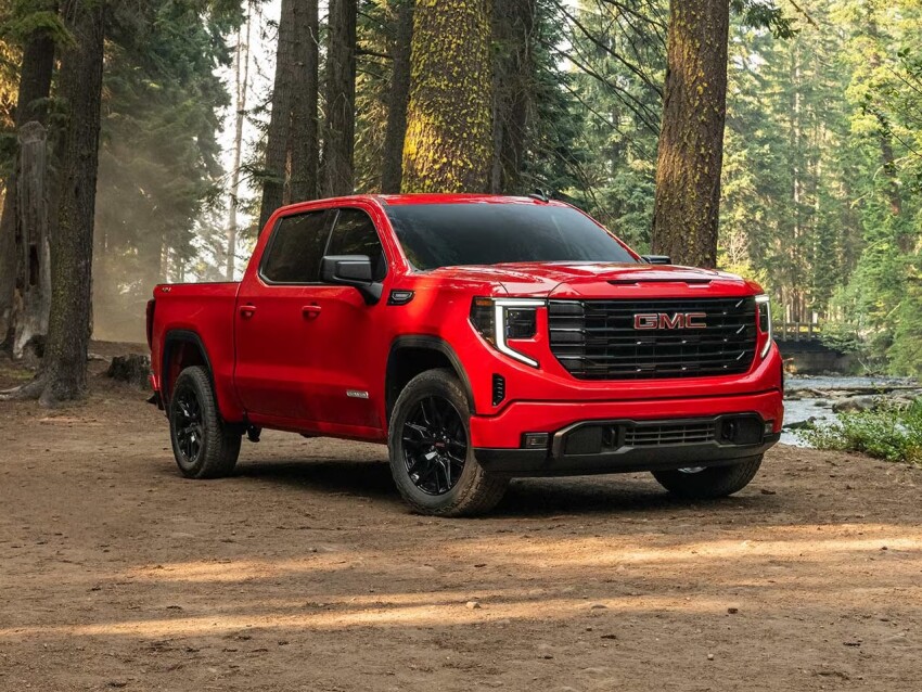 Red 2026 GMC Sierra 1500 in the woods
