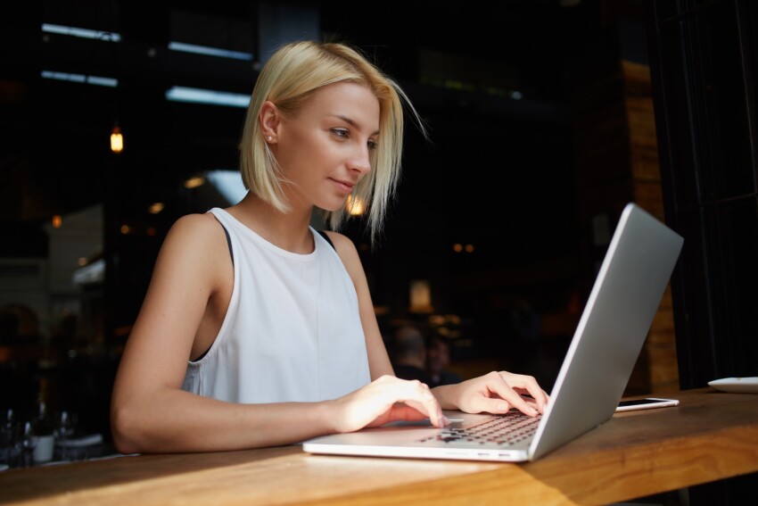 Woman sitting at laptop.