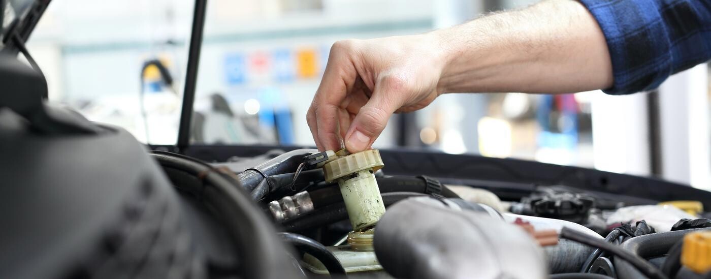 Mechanic checking brake fluid