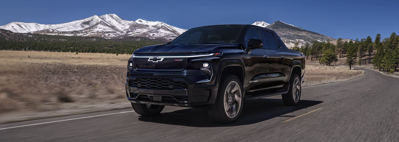 2025 Chevrolet Silverado EV driving in mountains