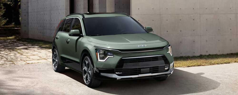 2026 Kia Niro Hybrid SX Touring in Cityscape Green Color with Black Aeroblade, LED daytime running lights (DRLs), and Power Sunroof 2026 Kia Niro Hybrid SX Touring in Cityscape Green Color with Black Aeroblade, LED daytime running lights (DRLs), and Power Sunroof