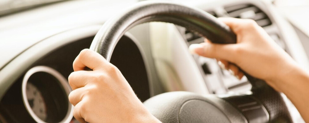 Hands on a steering wheel