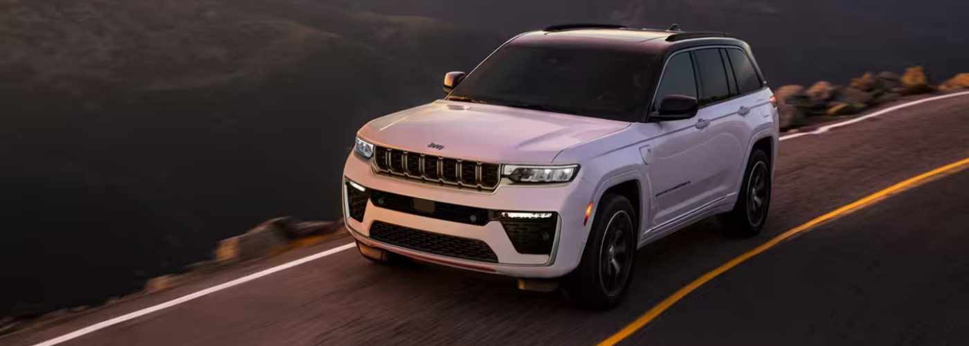 2026 Jeep Grand Cherokee 2026 Jeep Grand Cherokee Driving on a scenic road