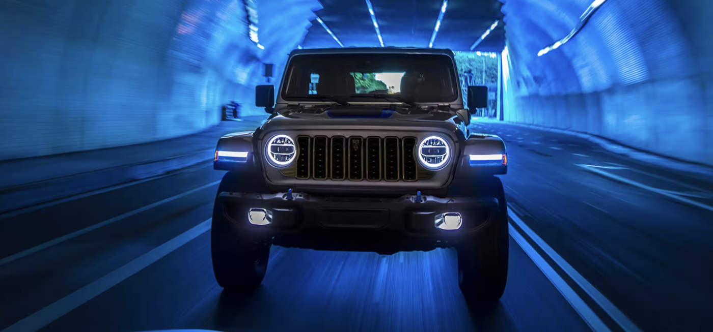 2024 Jeep Wrangler 4xe driving through a tunnel