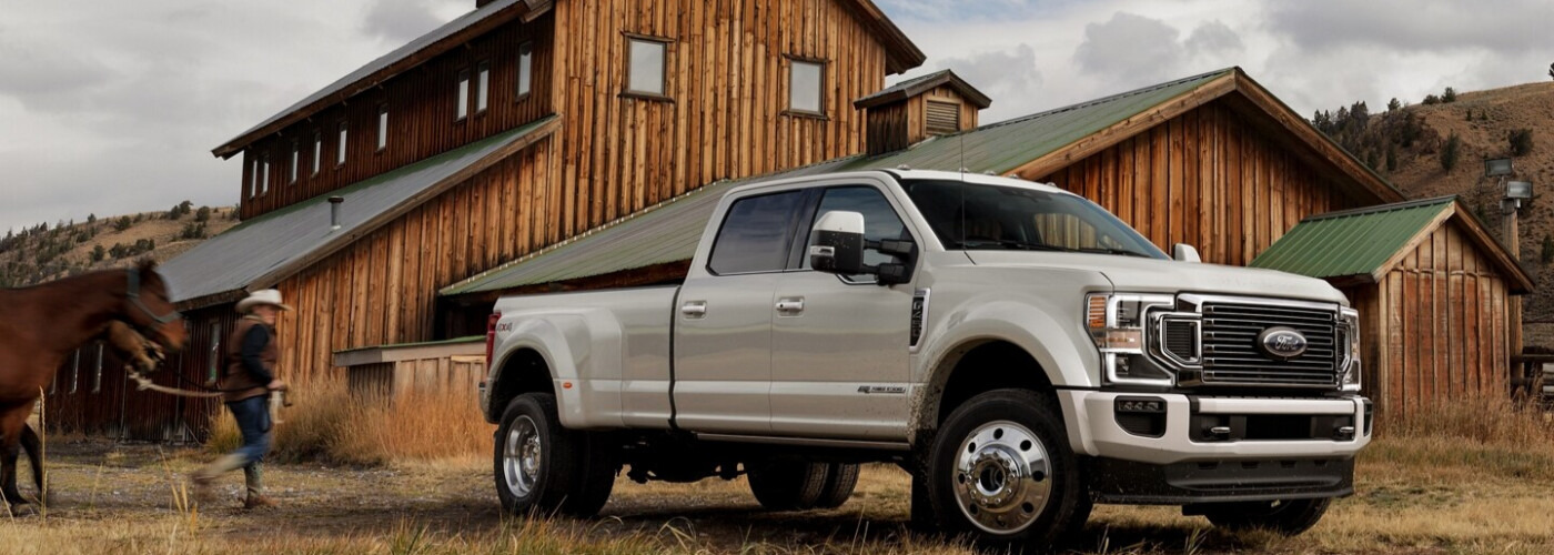 2021 Ford F-450 Limited Crew Cab parked near a barn.jpeg