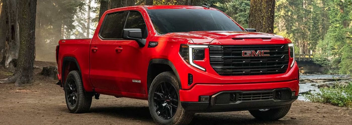 Red 2026 GMC Sierra 1500 in the woods
