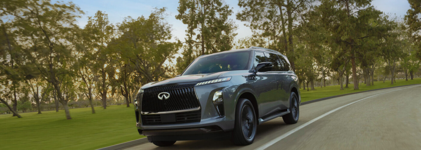 2025 INFINITI QX80 driving past park