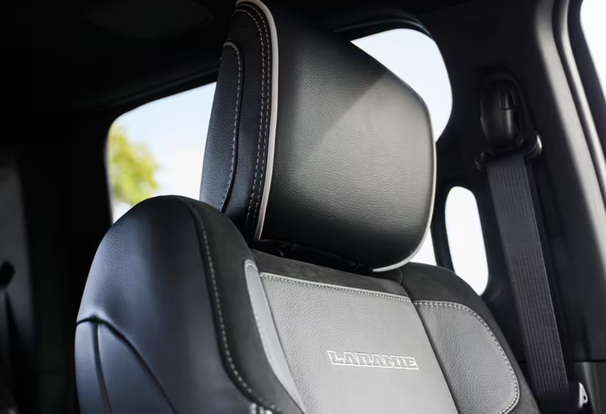 The seat in this truck is black and silver leather. 