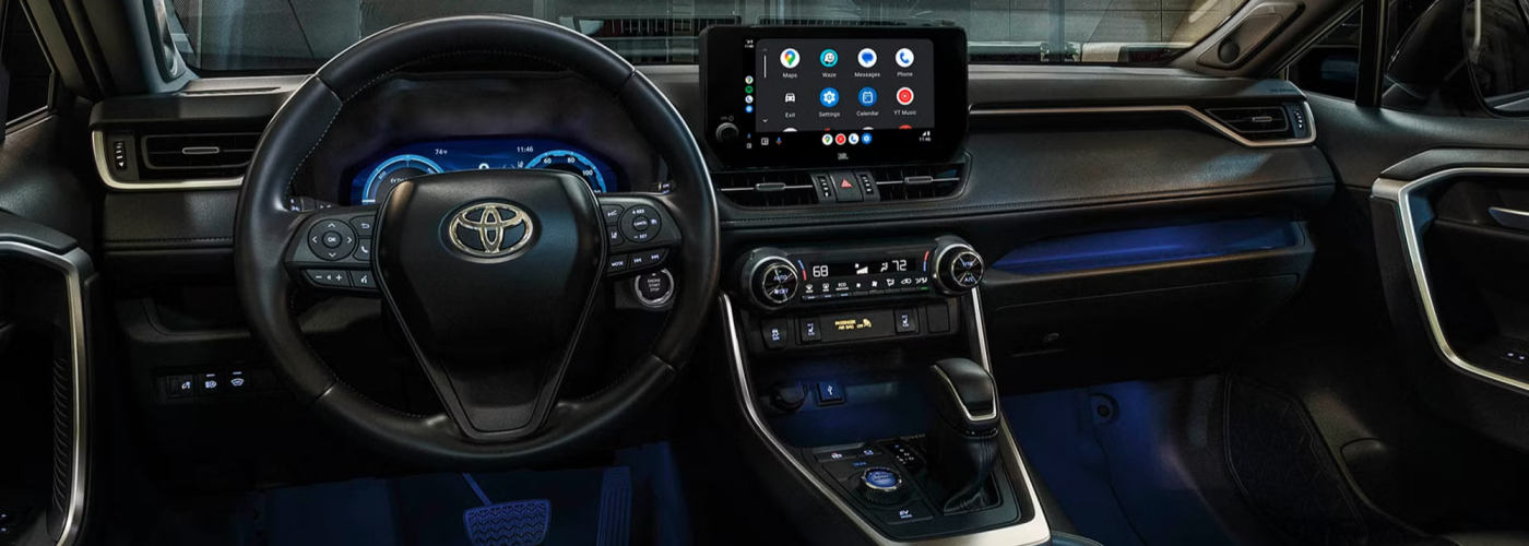2025 Toyota RAV4 Hybrid XSE interior shown in Black/Blue SofTex® trim with Advanced Technology Package and 11-speaker JBL®