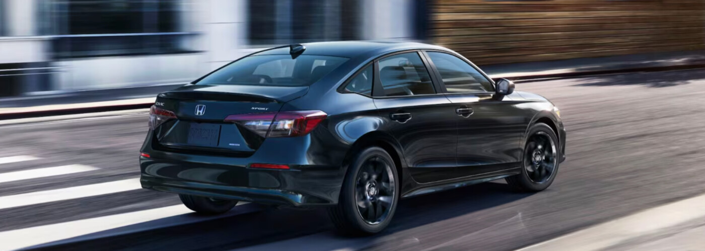 2026 Honda Civic Sedan exterior black driving on road