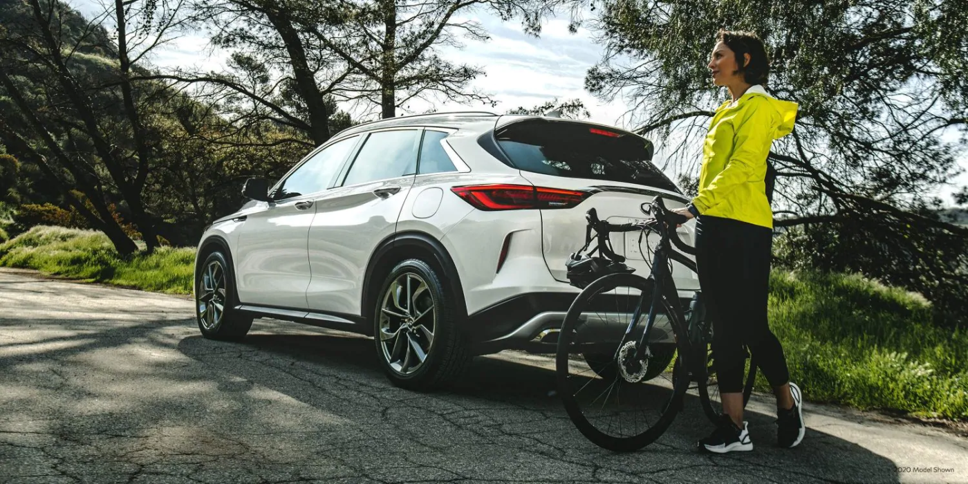 2021 INFINITI QX50 Parked with Biker 2021 INFINITI QX50 Parked with Biker