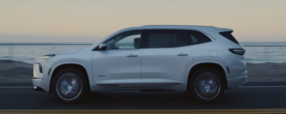 2026 Buick Enclave driving down the road