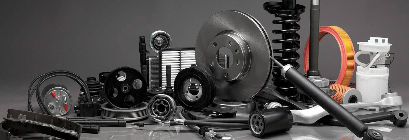 An assortment of Automotive parts on a dark background