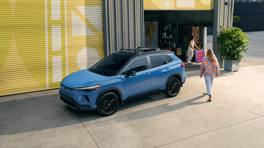 Blue 2026 Toyota Corolla Cross parked outside store