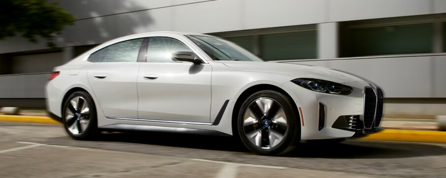 A white 2024 BMW i4 on road