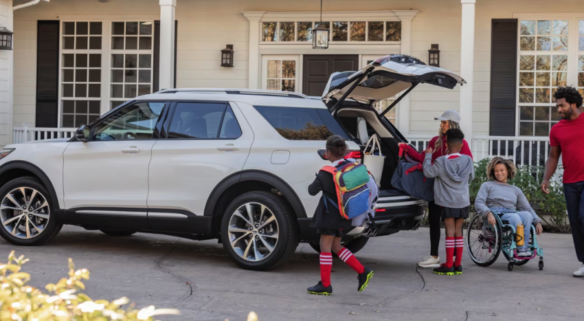 Parked Ford Explorer with Family