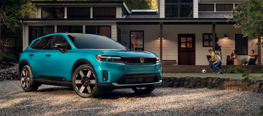 2026 Honda Prologue parked in front of house with family spending time outside