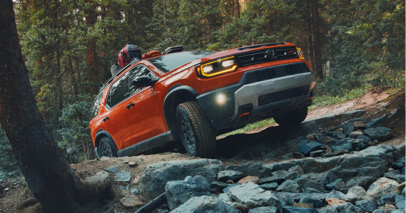 Orange 2026 Honda Passport in Forest