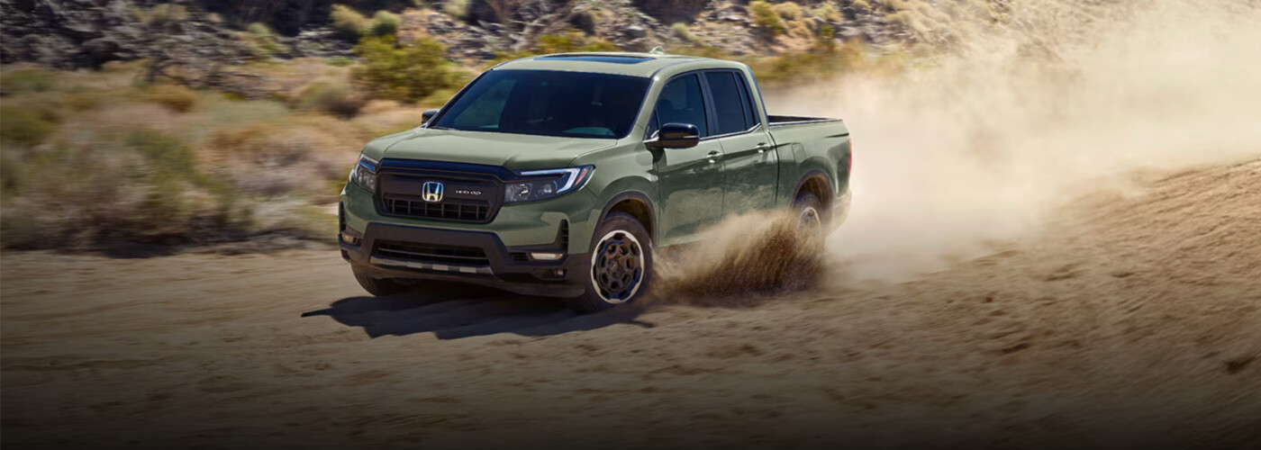 ash green 2026 Honda Ridgeline drives through dessert