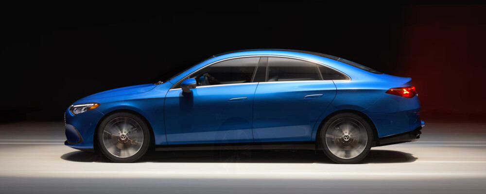 Blue 2026 Mercedes-Benz CLA Sedan facing left in spot light