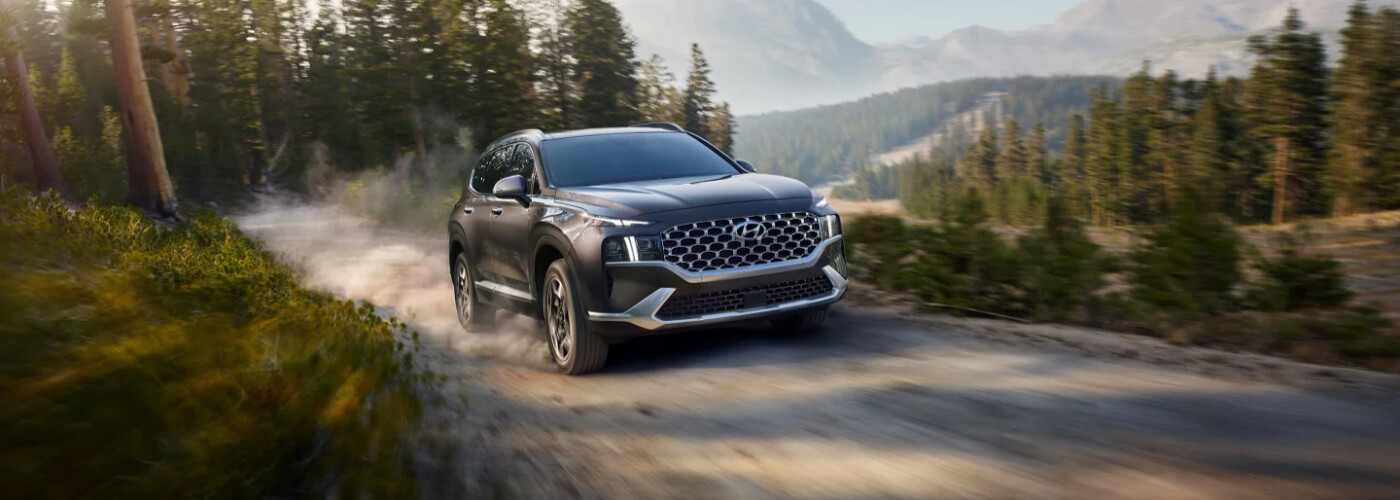 2023 Santa Fe Hybrid driving on dirt road 