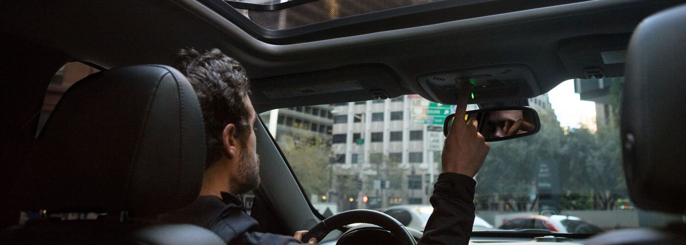 2021 Chevrolet Malibu Interior Man opening sunroof on Chevy Malibu